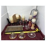 various candle holders and decorative glassware