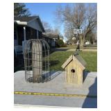 Wooden birdhouse and metal bird caged bird feeder