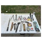 assorted hand tools, chalk line, tape measure,