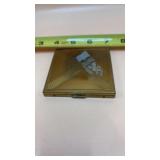 Gold Toned Metal Powder compact featuring a