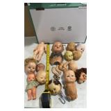Collection of vintage doll, heads, and body parts