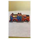 tin toy fire engine, likely manufactured