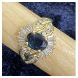 14kt gold with oval-cut blue sapphire center