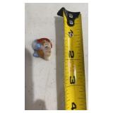 vintage porcelain figurine head, likely a