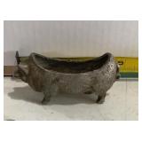 vintage-style metal pig planter or trough, likely