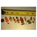 Eight vintage charm size people one is a Mexican