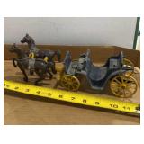 vintage cast iron horse-drawn carriage toy and
