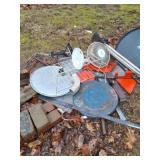 Scrap pile by garage and behind house