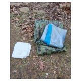 Tarps. Camouflage tarp has holes in it