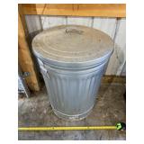 Trash can with grass seed.