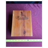The Holy Bible in cedar wood case.