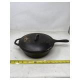 Lodge cast iron pan with lid.