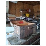 Vintage trunk with rust and broken strap handles.