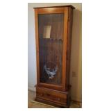 Gun cabinet holds 6 with deer logo on front. One