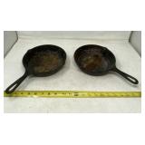 Two small Lodge skillets.