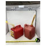 Two 2 gallon gas jugs.