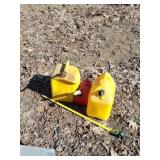 Two diesel 5 gallon jugs and gas jug.