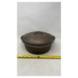 Lodge cast iron pot with lid.