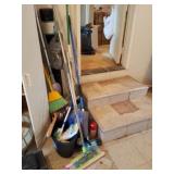 Mops, brooms, sweeper and new rug.