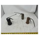 manual pump oil cans, likely manufactured by