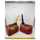 Two 1 gallon gas jugs one has  mixed gas for