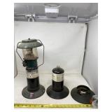 Propane lantern and empty propane tanks.