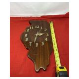 Wood clock in the shape of Illinois .