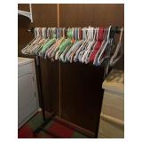 Roll around clothes hanger with hangers.