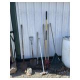 Rakes shovels and post hole digger