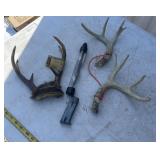 Antlers with drill bits and gun mag