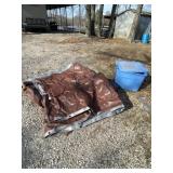 Tarp with some holes, tote with lid and bungee