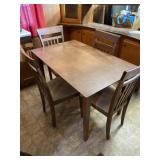 Coaster Fine Furniture table and four chairs.