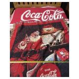 Two Coca Cola throws and pot holder.