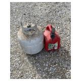 Empty propane tank and 2 gallon gas jug