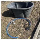 Plastic tub with pool motor and pipe