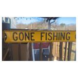 Metal gun fishing sign