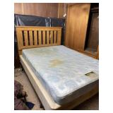 Queen size bed with nightstand. Beautyrest