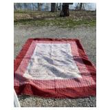 Queen size quilt with tote and lid.