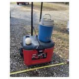Coleman cooler on wheels and has handle with