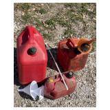 Three gas cans, 5 gallon 2 gallon and a 1 gallon