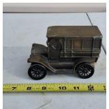 metal coin bank designed as a 1908 Cadillac,