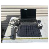 Toshiba laptop with cords and extension cord