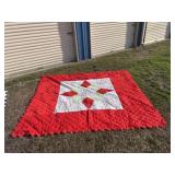 86x96 red flowered quilt with white bottoms