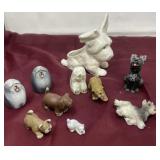 Collection of dog figurines, and a planter