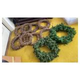 Eight grapevine wreaths and two artificial pine