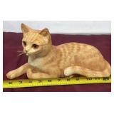 Cat laying by ENESCO