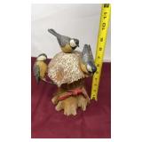 black-capped chickadees perched on a textured