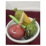Ceramic vegetables in a white bowl