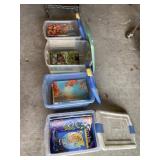 Four totes with Ideal books in them and lids.