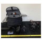 Canon Rebel XSI camera with three zoom lenses,